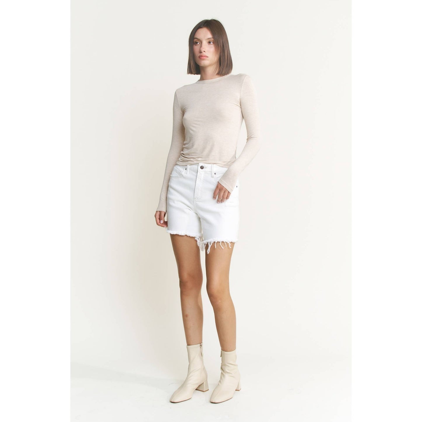 Distressed High Rise Frayed Denim Shorts in Misty White