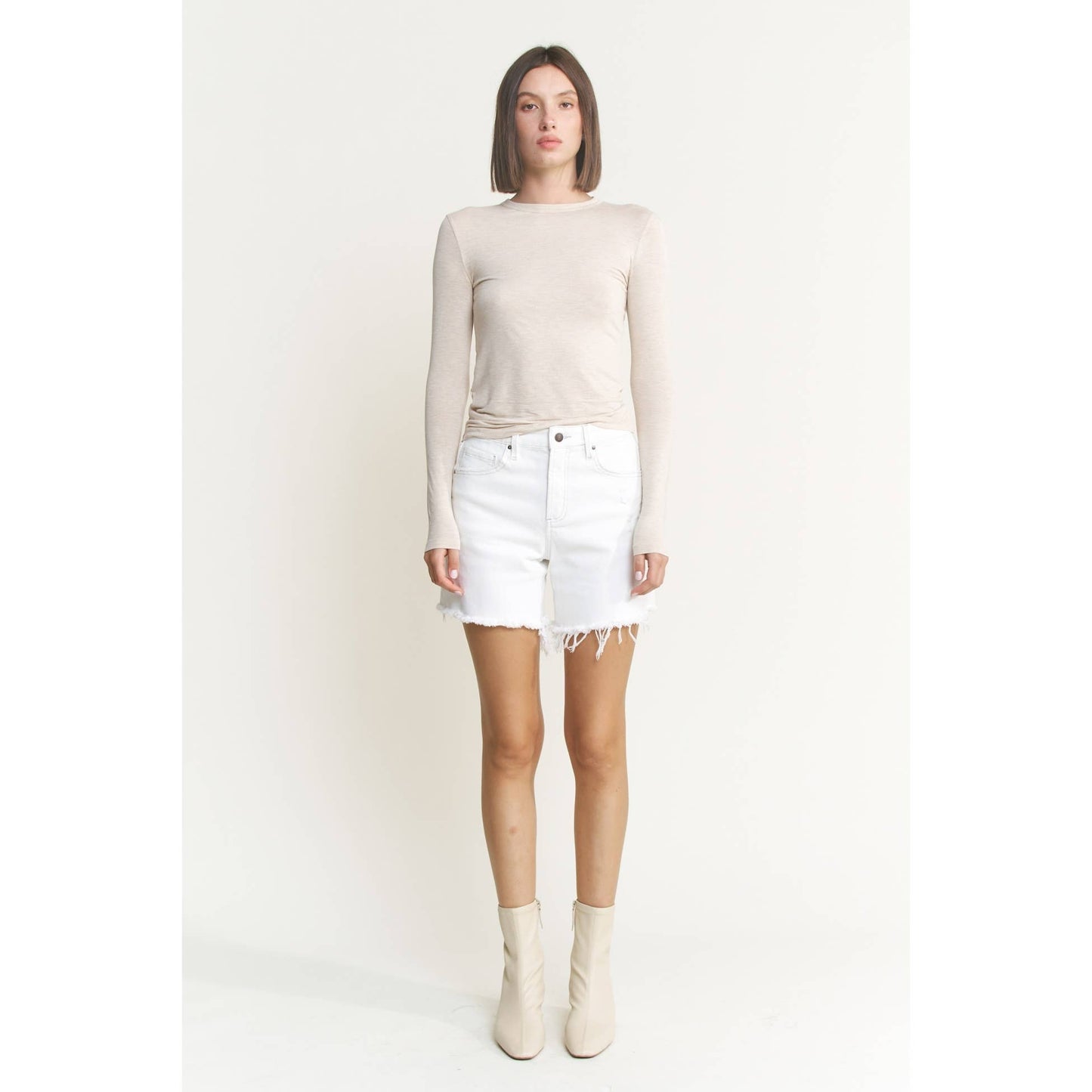 Distressed High Rise Frayed Denim Shorts in Misty White
