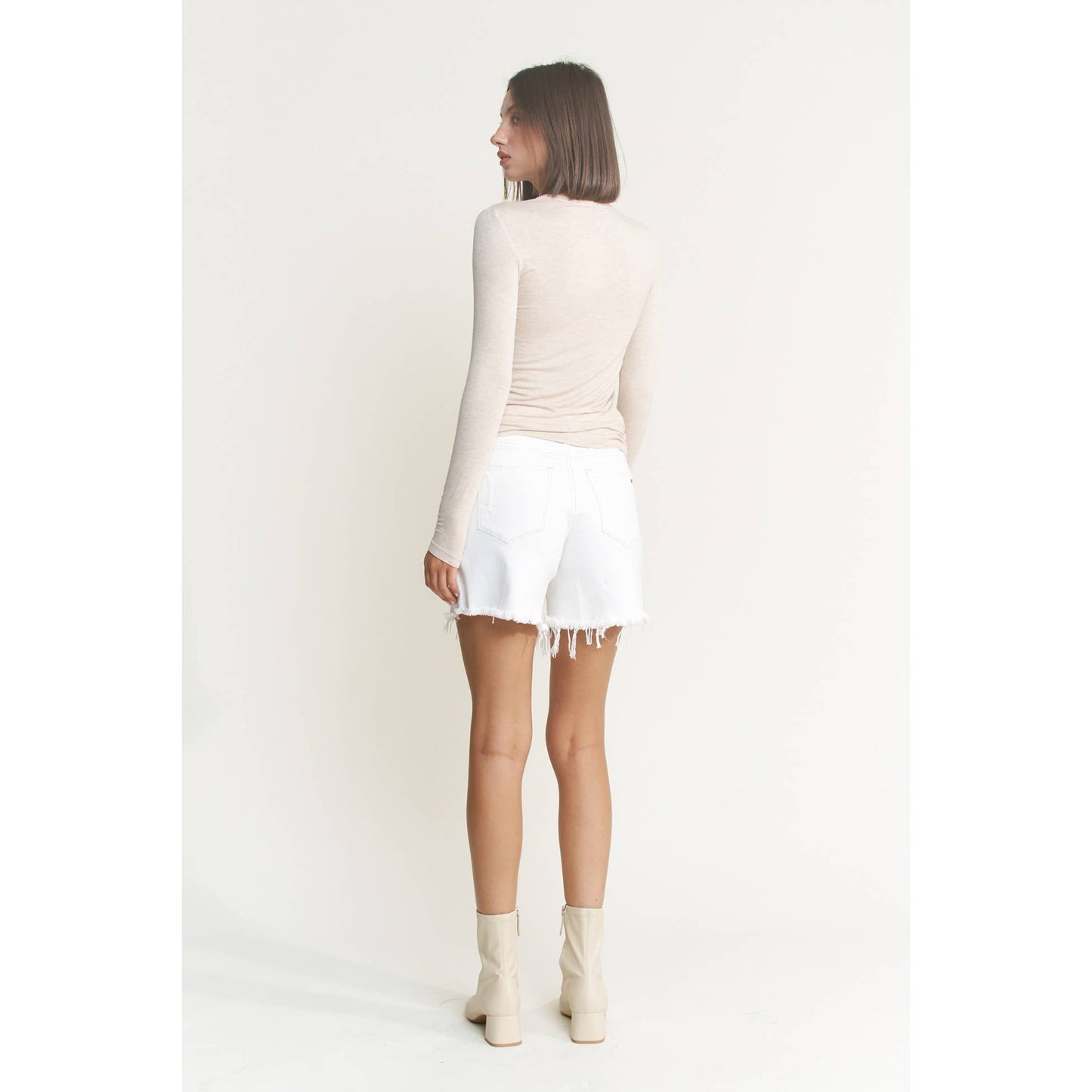 Distressed High Rise Frayed Denim Shorts in Misty White