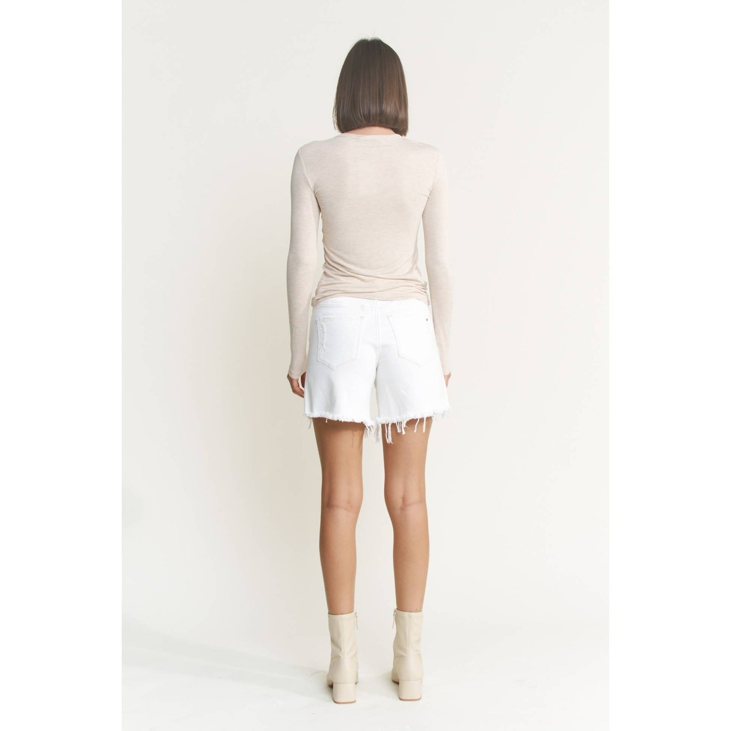 Distressed High Rise Frayed Denim Shorts in Misty White