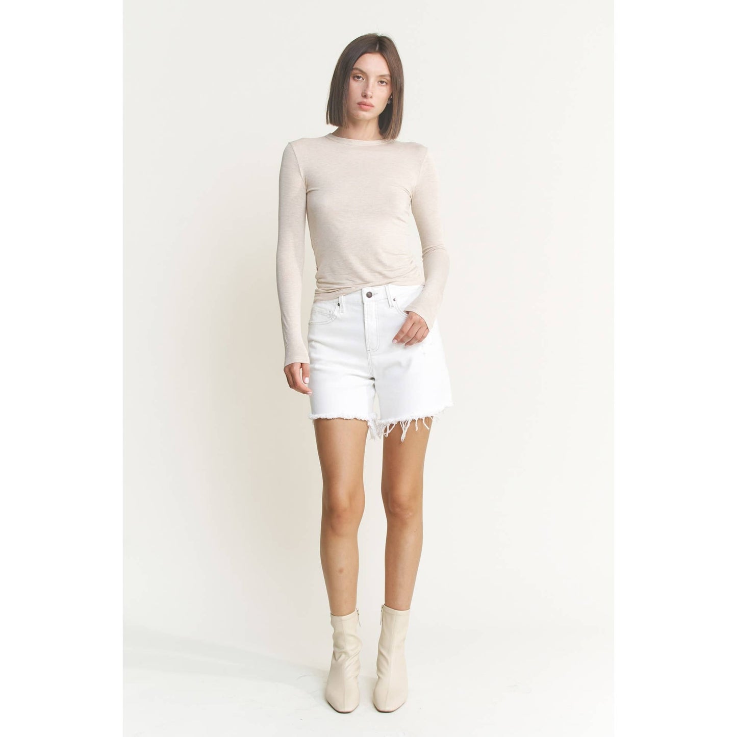 Distressed High Rise Frayed Denim Shorts in Misty White